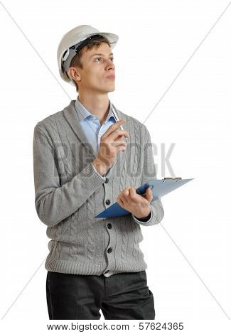 Builder In A Protective Helmet And With A Clipboard