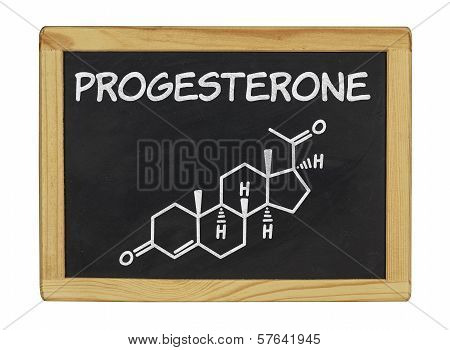 chemical formula of progesterone on a blackboard