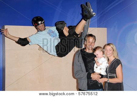 Tony Hawk with Lhotse Merriam and their daughter Kadence at the Unveiling of Madame Tussauds Wax Figure of Tony Hawk. Madame Tussauds Wax Museum, Hollywood, CA. 07-29-09