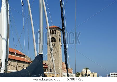 Rhodes Island Landmark, Mandraki Port, Greece. The Historical Port Is Still Used Today As A Marina B