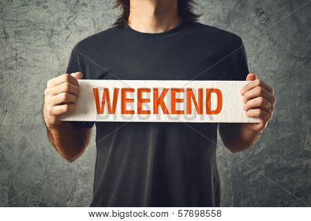 Man Holding Board With Weekend Title