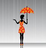 woman with an umbrella in a bright dress