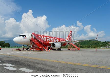 LANGKAWI - MAY 01: Airasia jet flight on May 01, 2014 in Langkawi, Malaysia. AirAsia Berhad is a Malaysian low-cost airline headquartered in Kuala Lumpur, Malaysia