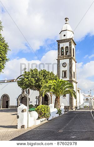 L Church Of San Gines In Arrecife With Its White-washed Exterior And Attractive Bell Tower