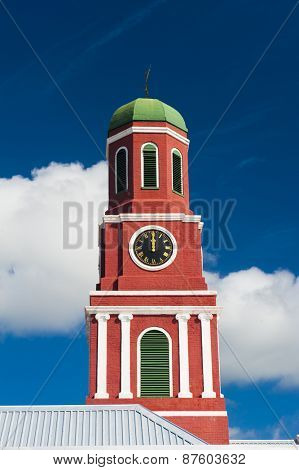Famous red clock tower on the main guardhouse at the Garrison Savannah. UNESCO garrison historic area Bridgetown, Barbados