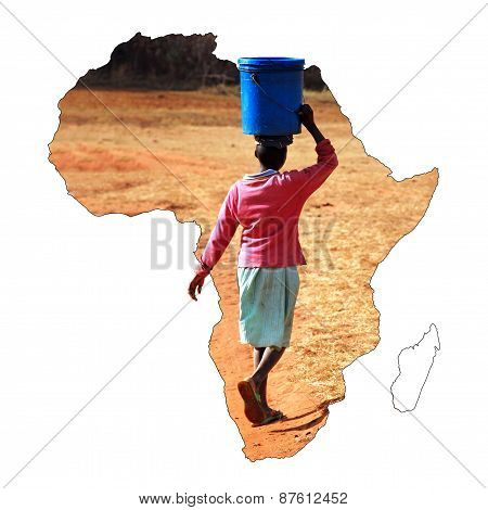 A Young African Girl Carrying A Bucket Of Water On Her Head