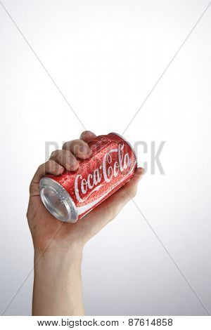 Kuala Lumpur,Malaysia 9th April 2015, hand holding a red Coca Cola can drinks.Coca Cola drinks are produced and manufactured by The Coca-Cola Company