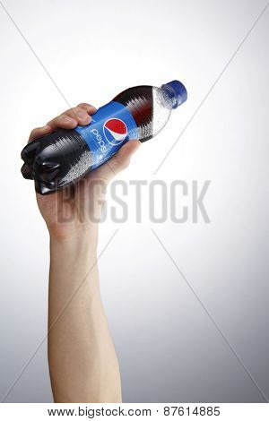 Kuala Lumpur,Malaysia 9th April 2015,Holding a can of Pepsi . Pepsi is a carbonated soft drink produced and manufactured by PepsiCo Inc. an American multinational food and beverage company.