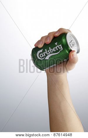 Kuala Lumpur,Malaysia 9th April 2015,hand holding a can of the carlsberg beer drink