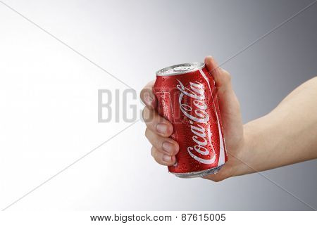 Kuala Lumpur,Malaysia 9th April 2015, hand holding a red Coca Cola can drinks.Coca Cola drinks are produced and manufactured by The Coca-Cola Company