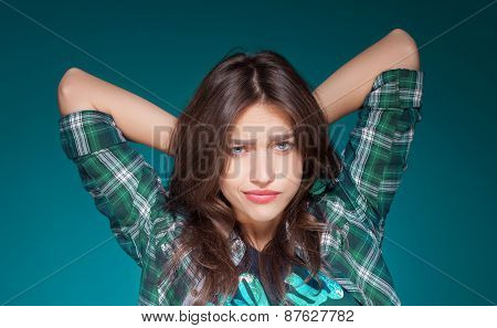 young beautiful girl posing grimacing with chewing gum