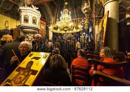 ATHENS, GREECE - APR 10, 2015: Unidentified people during the celebration of Orthodox Easter - Vespers on Great Friday (the Epitaphios in Greek served in Good Friday evening). 