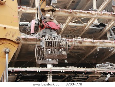 Crane Grab Tool At Demolition Of Business Building