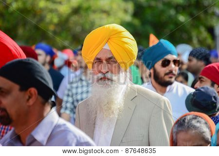 Devotee Sikh With Yellow Turban Marching