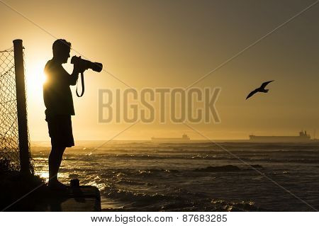 Silhouetted Wildlife Photographer