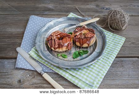 Cinnamon Donuts With Caramel Icing And Pekans Served With Fresh