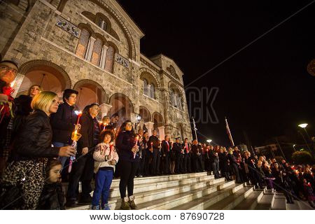 ATHENS, GREECE - APR 12, 2015: Unknown people during celebration of Orthodox Easter (Midnight Office of Pascha) Holy Saturday is often the only time that the Midnight Office will be read in parishes.