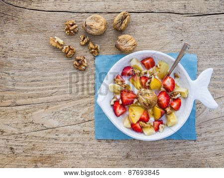 A Bowl Of Fruit, Walnuts And Yogurt