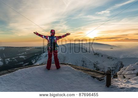 Girl Watching At The Sunset On The Top Of Mountain