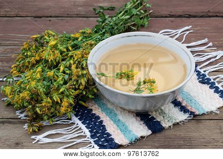 A Bunch Of Flowers St. John's Wort And Freshly Brewed Tea