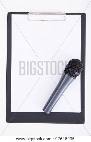 Speech Concept - Microphone And Clipboard With Blank Paper