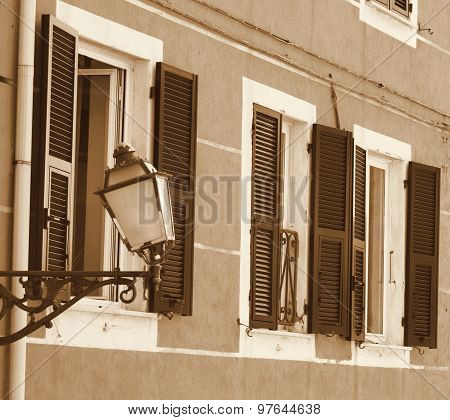 Italy. Cinque Terre. Riomaggiore Village. Lantern On The Wall. In Sepia Toned. Retro Style