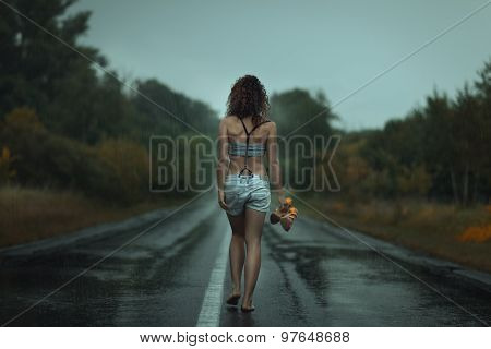 Girl Back. Walks On The Road. Under Rain.