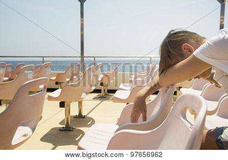 Boy Sleeping On The Deck-chair