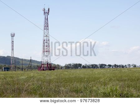 Cellular tower in sunny summer day