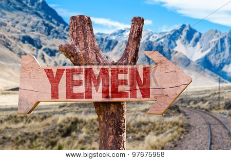 Yemen wooden sign with desert road background