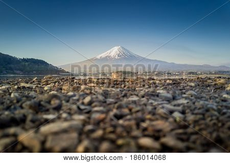 Mountain Fuji reflected in Kawaguchiko lake on a sunny day and clear sky, Yamanashi Japan