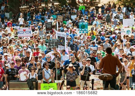 ATLANTA, GA - APRIL 22:  Thousands listen to a person speaking on the stage at Candler Park at a rally preceding the Atlanta March for Science in Atlanta GA on Earth Day on April 22 2017.