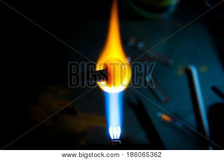 Birth of glass bead in hot fire