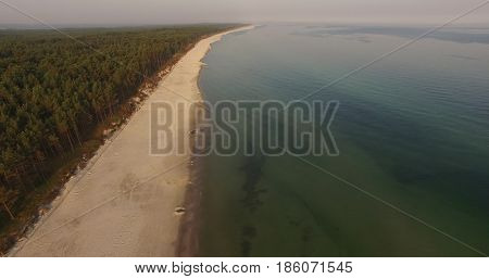 Aerial view of Baltic sea shore, waves and sandy beach. Lubiatowo, Poland