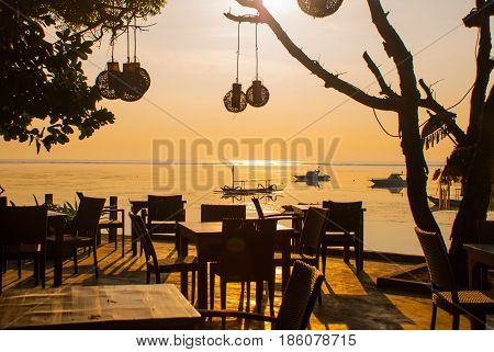 Beautiful Beach With A Cafe In Sanur With Local Traditional Boats. Bali. Indonesia