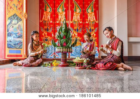KHONKHAEN THAILAND - DECEMBER 20 2015: Thai northeastern traditional liftstyle in making rice offering and garland for any special occasions and events in Buddhist temple in Khonkhaen.