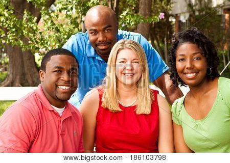 Happy commuinity group of people talking and laughing.