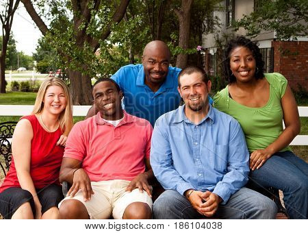 Happy commuinity group of people talking and laughing.