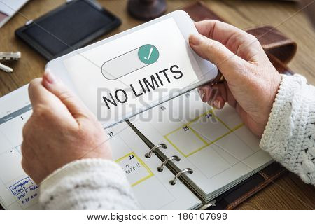 Hands working on digital device network graphic overlay