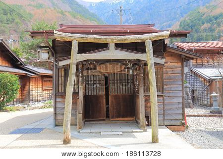 NAGANO JAPAN - APRIL 20, 2017: Small street shrine on Naraijyuku historical house street. Naraijyuku is famous for preserved traditional houses and accommodation.