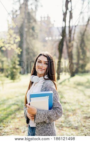 University College Student Girl Looking Happy Smiling With Book Or Notebook In Campus Park. Caucasia