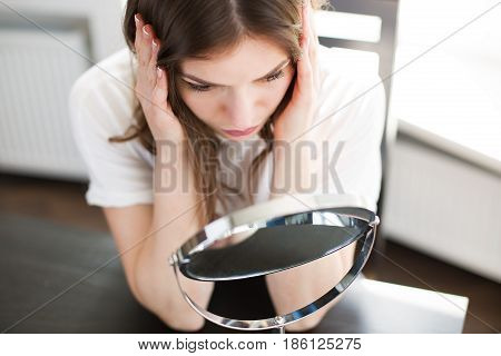 Woman With A Mirror