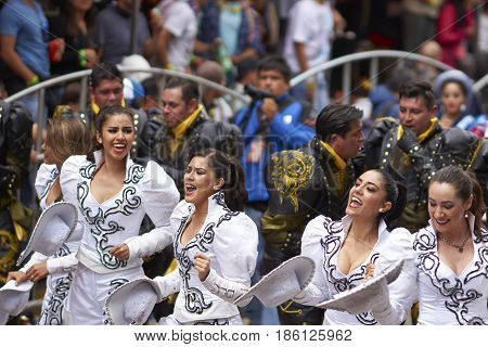 ORURO, BOLIVIA - FEBRUARY 26, 2017: Caporales dancers in ornate costumes performing as they parade through the mining city of Oruro on the Altiplano of Bolivia during the annual carnival.