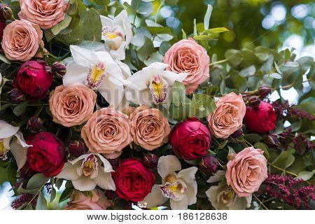 Beautiful Wedding Ceremony Outdoors. Decorated Chairs Stand On The Grass. Wedding Arch Made  Flowers