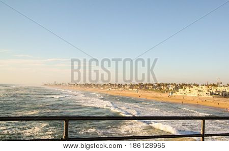 Beautiful ocean scene standing on pier overlooking California coast line.