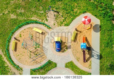 Small children's playground with a bird's-eye view.