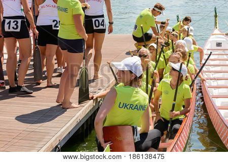 Rome Italy - July 30 2016: Dragon boat crews compete at the european championships held in Italy in 2016 summer in the photo the Ukrainian crew a nice girl smiling after the race
