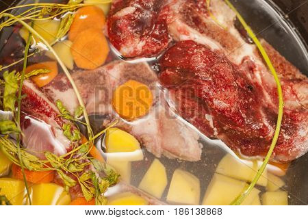 Beef bone bouillon soup cooking Ingredients in souse pan