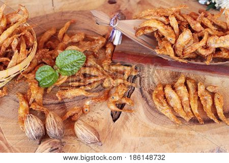 Fried fish is tasty on wood background