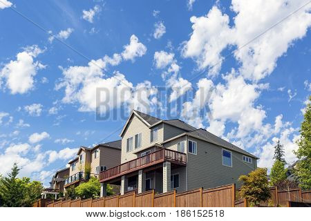 North American homes with backyard decks and wood fencing in typical suburban residential area